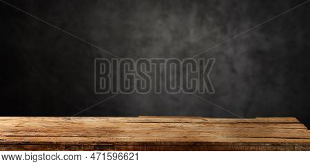 Empty Dark Wooden Table In Front  Background Of Plaster Texture Of Old Gray Concrete
