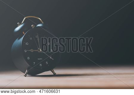 A Black Alarm Clock Sits On The Table , Time Management Concept,effective Business Planning,time Man