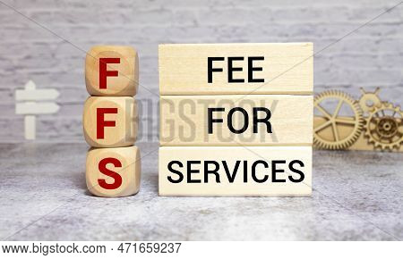 Concept Image Of Business Acronym Ffs As Fee For Services Written Over Road Marking Yellow Paint Lin