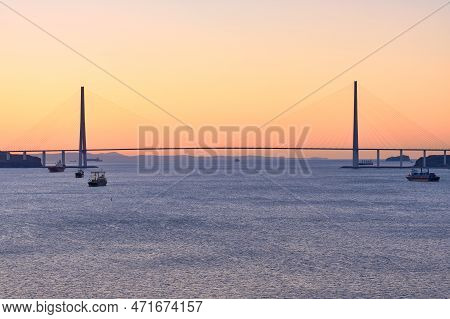 Suspended Cable-stayed Bridge From The Mainland Of The Far Eastern City To The Russian Island. The S