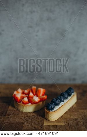 Beautiful Young Chef Decorating Delicious Dessert On Modern Kittchen