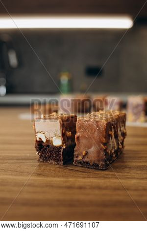 Beautiful Young Chef Decorating Delicious Dessert On Modern Kittchen