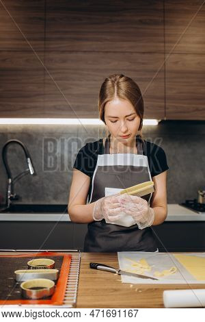 Pastry Chef Makes Muffins And Pours Dough Into Molds