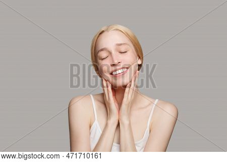 Portrait Of Happy Beautiful Woman With Hands Smiling Isolated On Grey Background. Beauty, Cosmetics,
