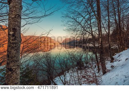 Beautiful Sunset Scenic Image Of Lake Bohinj And Old Slovenian Village Stara Fuzina In Background Se