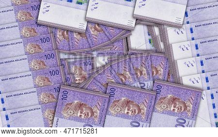 Malaysia Ringgit Banknotes In A Cash Fan Mosaic Pattern. Malaysian 100 Myr Notes. Abstract Concept O