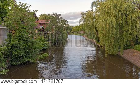 Water Canal Around Plantage In Amsterdam Netherlands At Evening
