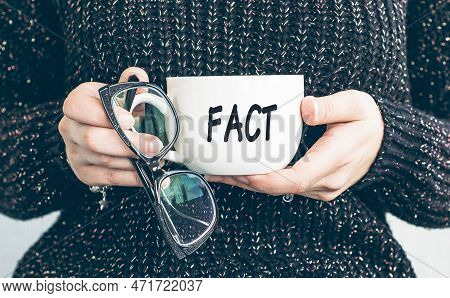 Fact, Text On A Cup Of Coffee In Woman Hand