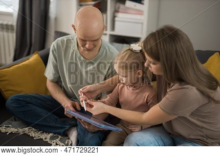 Cochlear Implant System. Installation Cochlear Implant On Child Girl Ear For Restores Hearing. Kid H
