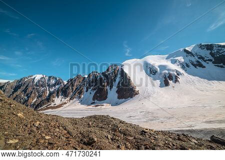 Scenic Mountain Landscape With Large Glacier In Sunlight. Awesome Snowy Scenery With Glacial Tongue 