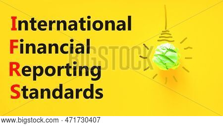 Ifrs Symbol. Concept Words Ifrs International Financial Reporting Standards On Yellow Paper Beautifu
