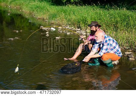 Men Hobby And Recreation. Fishermen Successful Catch Fish. Fisher Retirement. Retired Businessman In