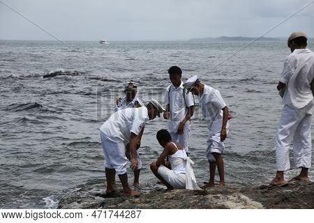 Salvador, Bahia, Brazil - January 1, 2023: Members Of Candombles Make Offerings On The Beach In Umai