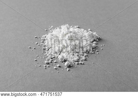 Heap Of Calcium Carbonate Powder On Grey Table
