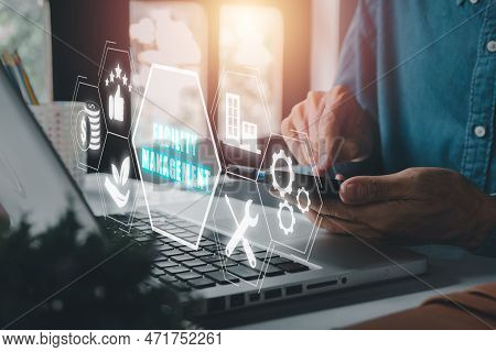 Facility Management Concept, Person Hand Using Smart Phone On Workplace With Facility Management Ico