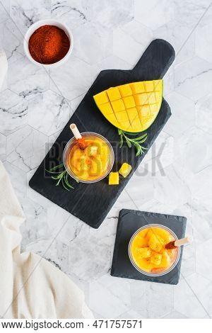 Mangonada Mexican  Smoothie From Mango With Chamoy Sauce And Tamarind Straw In Plastic Cups. Top And