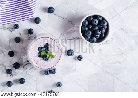 Smoothies With Blueberries And Mint In A Glass On The Table. Antioxidant Organic Diet Food. Top View