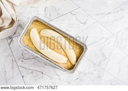 Raw Dough For Banana Bread In A Baking Dish On The Table. Social Media Trendy. Top View