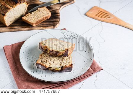 Sliced Banana Bread On A Plate On The Table. Homemade Trendy Breakfast