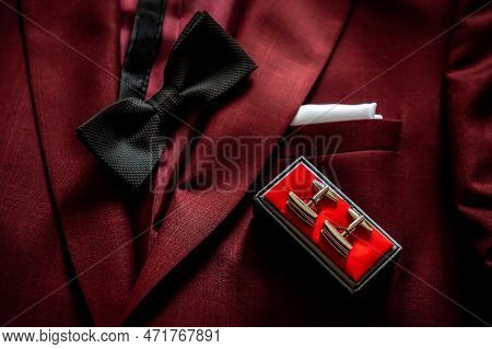 Bride And Groom's Wardrobe And Items Of Clothing Bow Tie, Cufflinks And Pocket Square Lying On A Mar