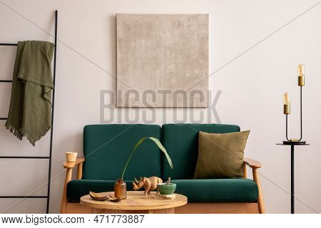 Elegant Living Room With Mock Up Paintings Frame, Bottle Green Sofa, Wooden Coffee Table, Cup Of Cof