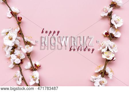 Sprigs Of The Apricot Tree With Flowers On Pink Background Text Happy Nowruz Holiday Concept Of Spri
