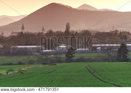 Suburb Of A Small Historic Town With Industrial Zone, Storages, Parking Trucks, Electric Power Lines