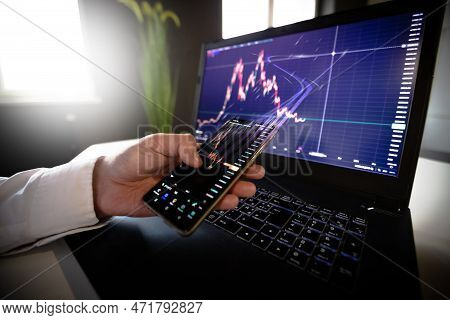 Crypto Currency Chart With Values Moving Up And Down, Trading Statistics And Analytics On Laptop Scr