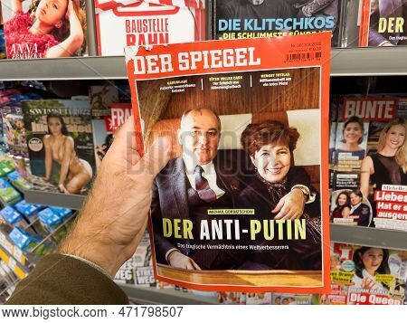 Frankfurt, Germany - Sep 3, 2022: Pov Male Hand Buying Latest Newspaper Magazine Der Spiegel With Mi