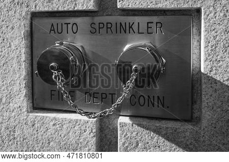 Auto Sprinkler Standpipe Connector. Fire Department Connection Covered Outside Of A Building On A Wa