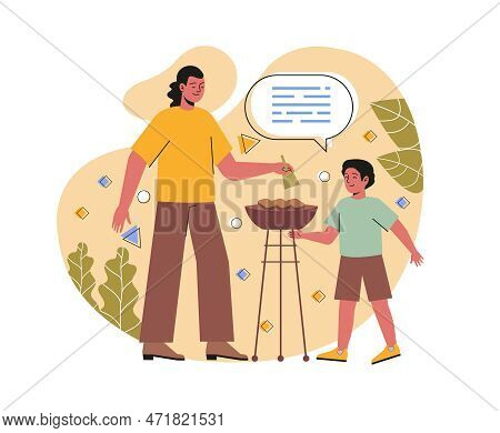 Family Outdoor Activities Concept. Young Father Frying Delicious Meat With In Backyard With His Son.