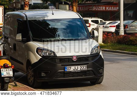 Side, Turkey -january 21, 2023:  White Fiat Doblo   Is Parked  On The Street On A Warm Summer Day Ag