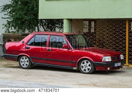 Side; Turkey - January 22 2023:  Red Tofas Dogan Parked On The Street On A Warm  Day