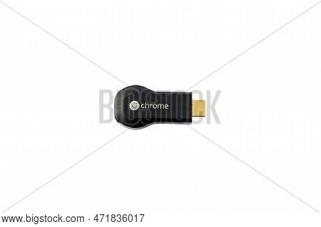 First Generation Chromecast Smart Tv Hdmi Dongle Isolated On White Background. February 17, 2023: Sw