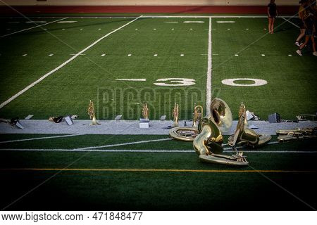 High School Sousaphone Insturments Up Close On Foot Ball Field