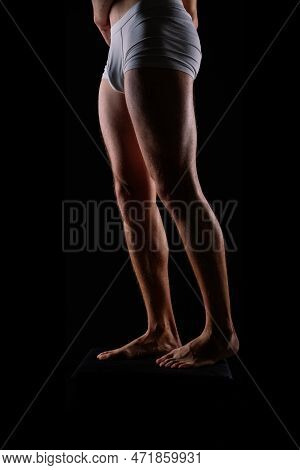 Close-up Of Bodybuilders Legs Ready For Competitive Sport White Panties