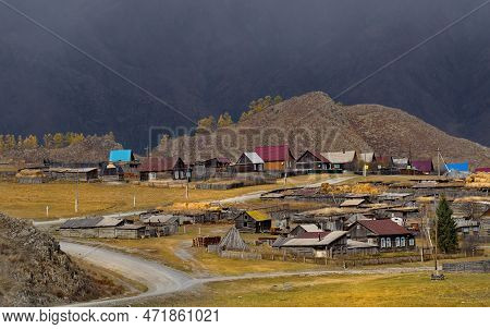 Russia. The South Of Western Siberia, The Altai Mountains. The Village Of Tenga, Illuminated By The 