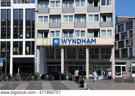 Cologne, Germany - September 21, 2020: People Walk By Wyndham Hotel In Cologne City, Germany. The Ho