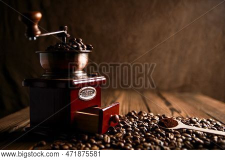 A Coffee Grinder And Coffee Black  Background