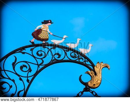 Colmar, France - December 13.2021: Image Of A Shepherdess With Three Geese In Colmar, Alsace, France