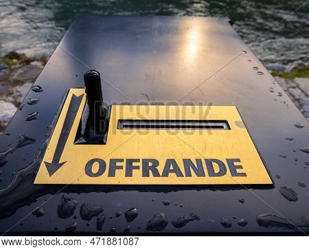 A Donation Box, With The French Inscription Offrande - English Translation: Donation