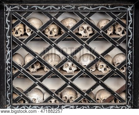 Human Skulls In The Ossuary At The Church Of San Vittore Mauro In Poschiavo, Switzerland, That Exist