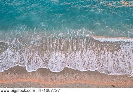 Straight Down View On Waves And Shore Of Small Stones By Bunec Beach Area In Summer 2022, Albania