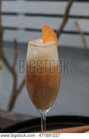 Iced Coffee Mixed With Orange Juice And Milk Decoration Piece Of Orange. Homemade Coffee Cocktail Ba