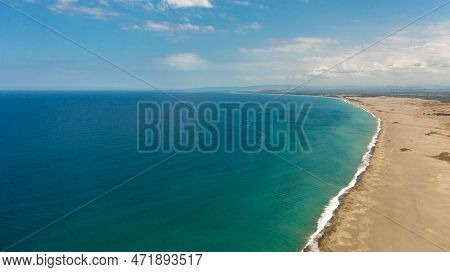 Sandy Beach And Ocean With Waves. Paoay Sand Dunes, Ilocos Norte, Philippines.