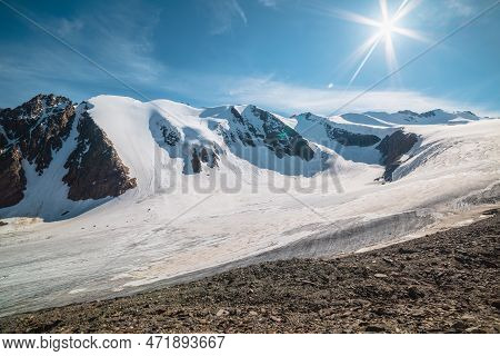 Scenic Mountain Landscape With Large Glacier In Sunlight. Awesome Scenery With Glacial Tongue Under 