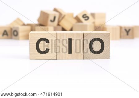 Text Cio - Chief Information Investment Officer - Is Written On Three Wooden Cubes Standing On A Whi