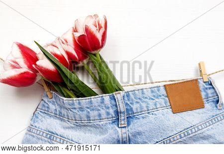 Tulips On Jeans And Spring Calling On Smartphone Kid Holding Flower