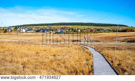 Wooden Path In Bozi Dar Peat Bog Nature Reservation On Sunny Autumn Day. Ore Mountains, Czech: Krusn
