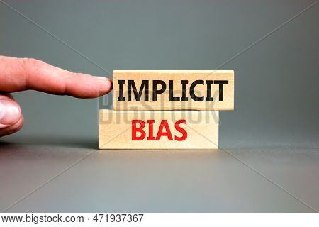Implicit Bias Symbol. Concept Words Implicit Bias On Wooden Block. Beautiful Grey Table Grey Backgro